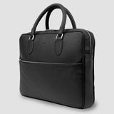 Black leather briefcase on a light gray background