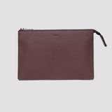 Sandalwood leather travel pouch in warm tan - full-grain Italian leather with top-stitched edges and brass zipper pull