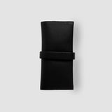 Black leather wallet on a light gray background