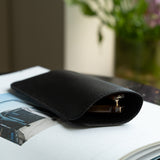 Black leather eyewear sleeve on the table