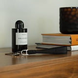 Black leather long keyring on the table