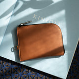 Brown Leather Zip Wallet on Kinfolk Magazine