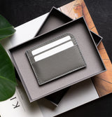Minimalist horizontal card holder in packaging by Ocult