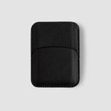 Black leather cardholder on a light gray background