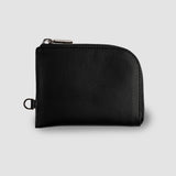Black leather wallet on a light gray background