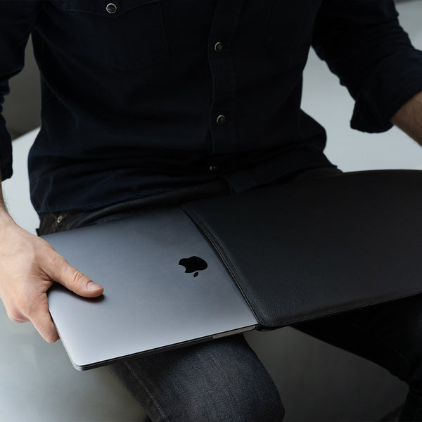 Black Leather MacBook Sleeve in Hands