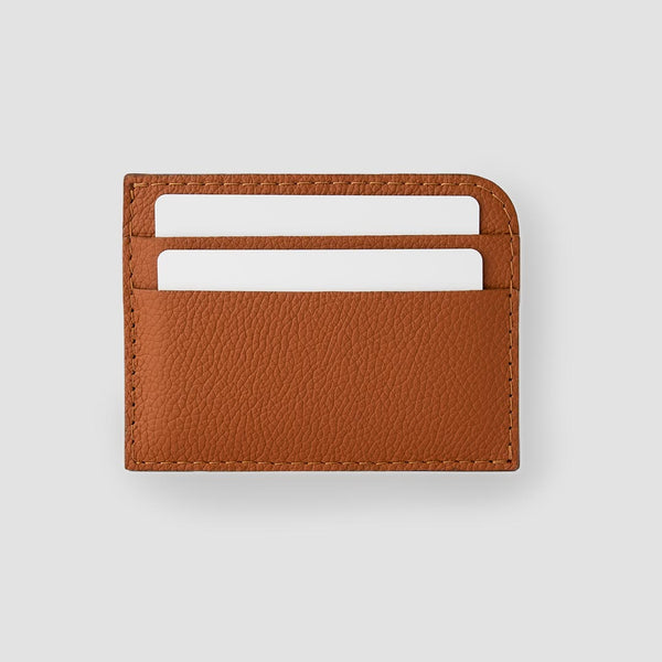 A uniquely constructed cardholder that easily handles bills through a side-opening, and five card slots for the essentials.