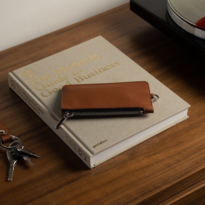 Brown Leather Zip Pouch Wallet on the Table