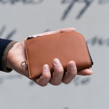Brown Leather Zip Wallet in Hands